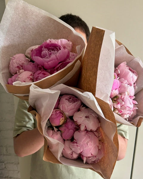 Bouquet of New York City peonies, being delivered