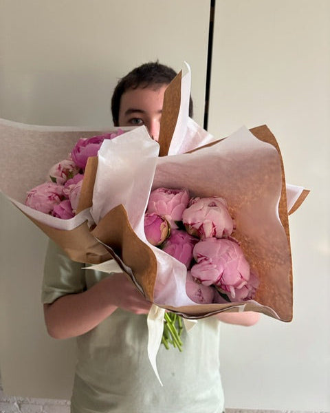 Bouquet of New York City peonies, being delivered
